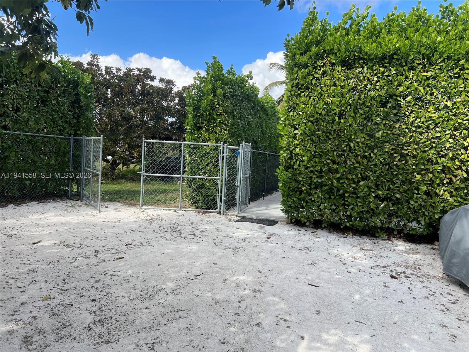 21600 Southwest 260th Street Homestead, FL 33031 - Photo 22 of 23 a view of a backyard with plants and tree