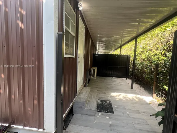 a view of backyard with seating space and hardwood floor