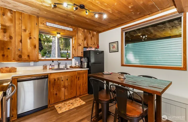 a kitchen with a sink stove and refrigerator