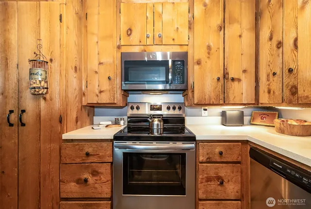a kitchen with a stove and a sink