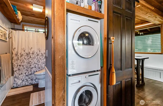 a view of a hallway with washer and dryer