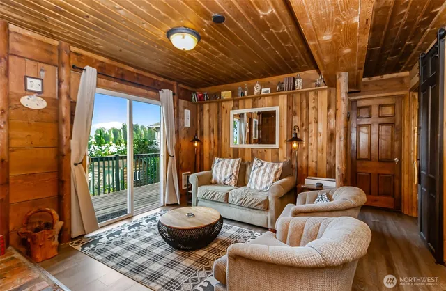 a living room with furniture and a rug