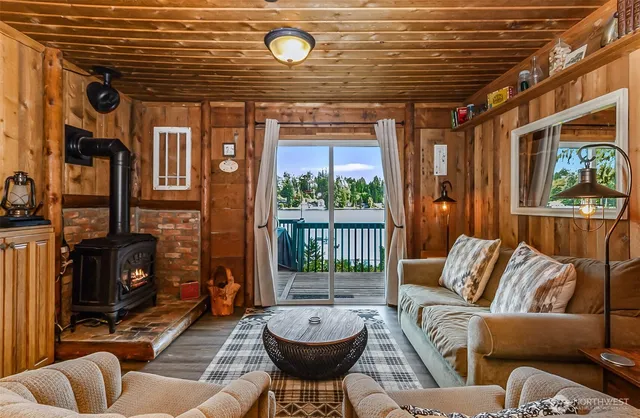 a living room with furniture a fireplace and a table