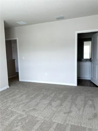 a bathroom with a shower and toilet
