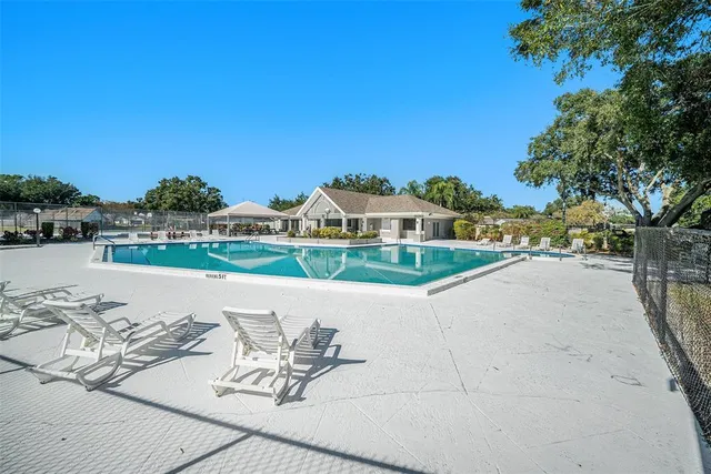 a view of a lake with outdoor space and seating area