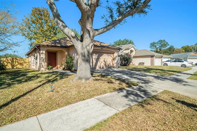a view of a house with a yard