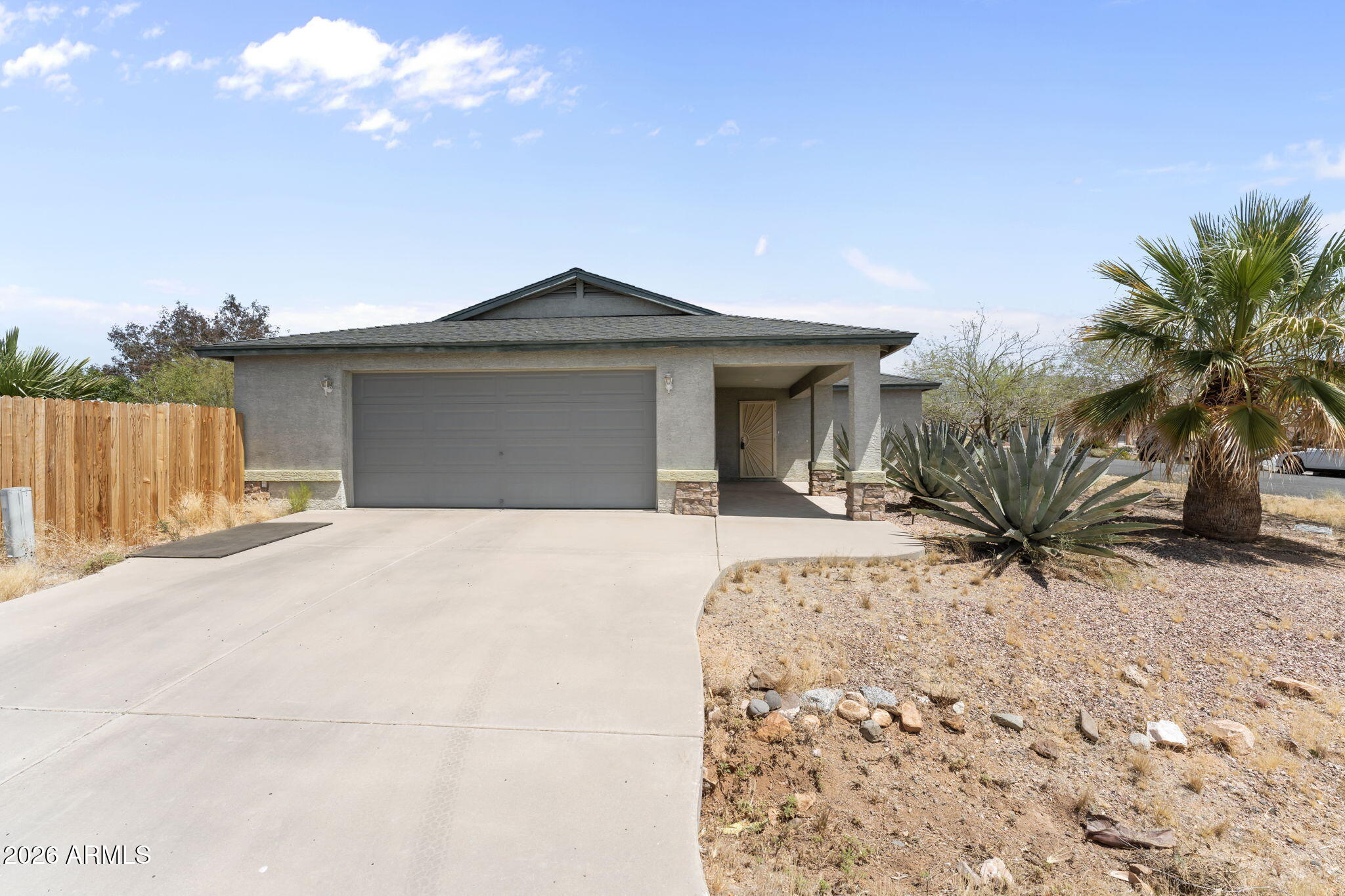 27144 Bennett Way Congress, AZ 85332 - Photo 2 of 33 a front view of a house with a yard
