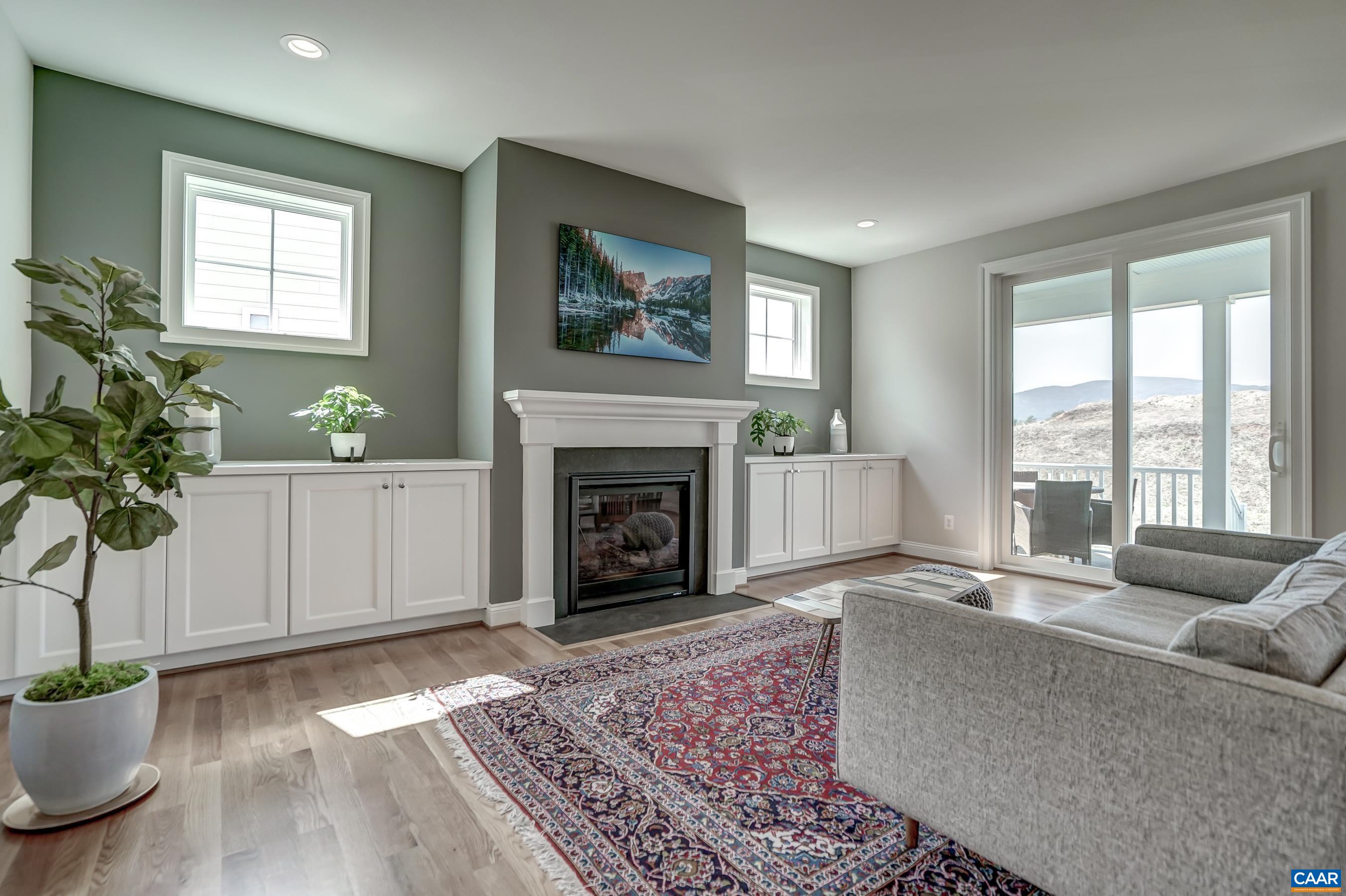 424 Claibourne Road Crozet, VA 22932 - Photo 11 of 64 a living room with furniture and a fireplace