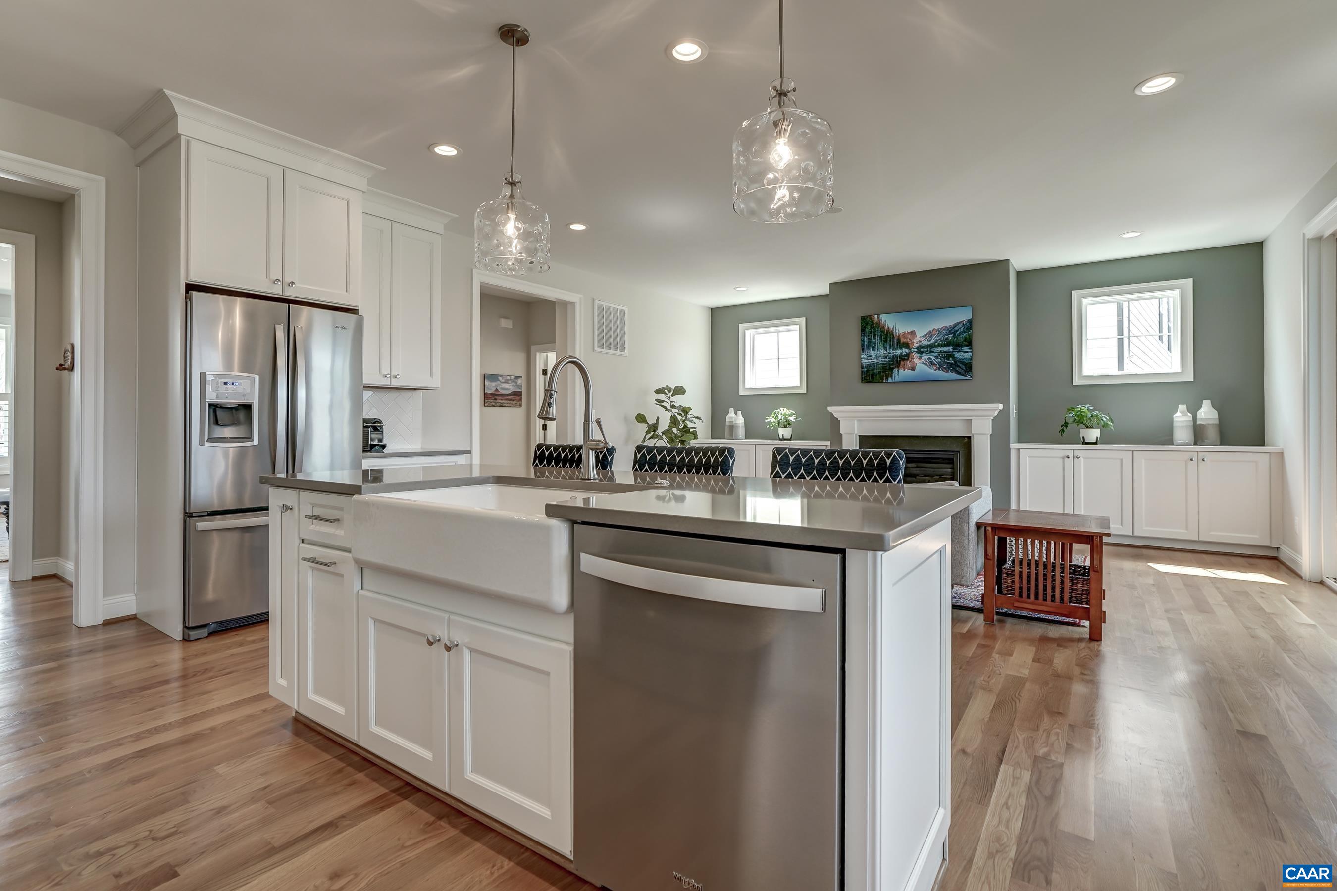 424 Claibourne Road Crozet, VA 22932 - Photo 15 of 64 a kitchen with kitchen island granite countertop a sink cabinets and wooden floor