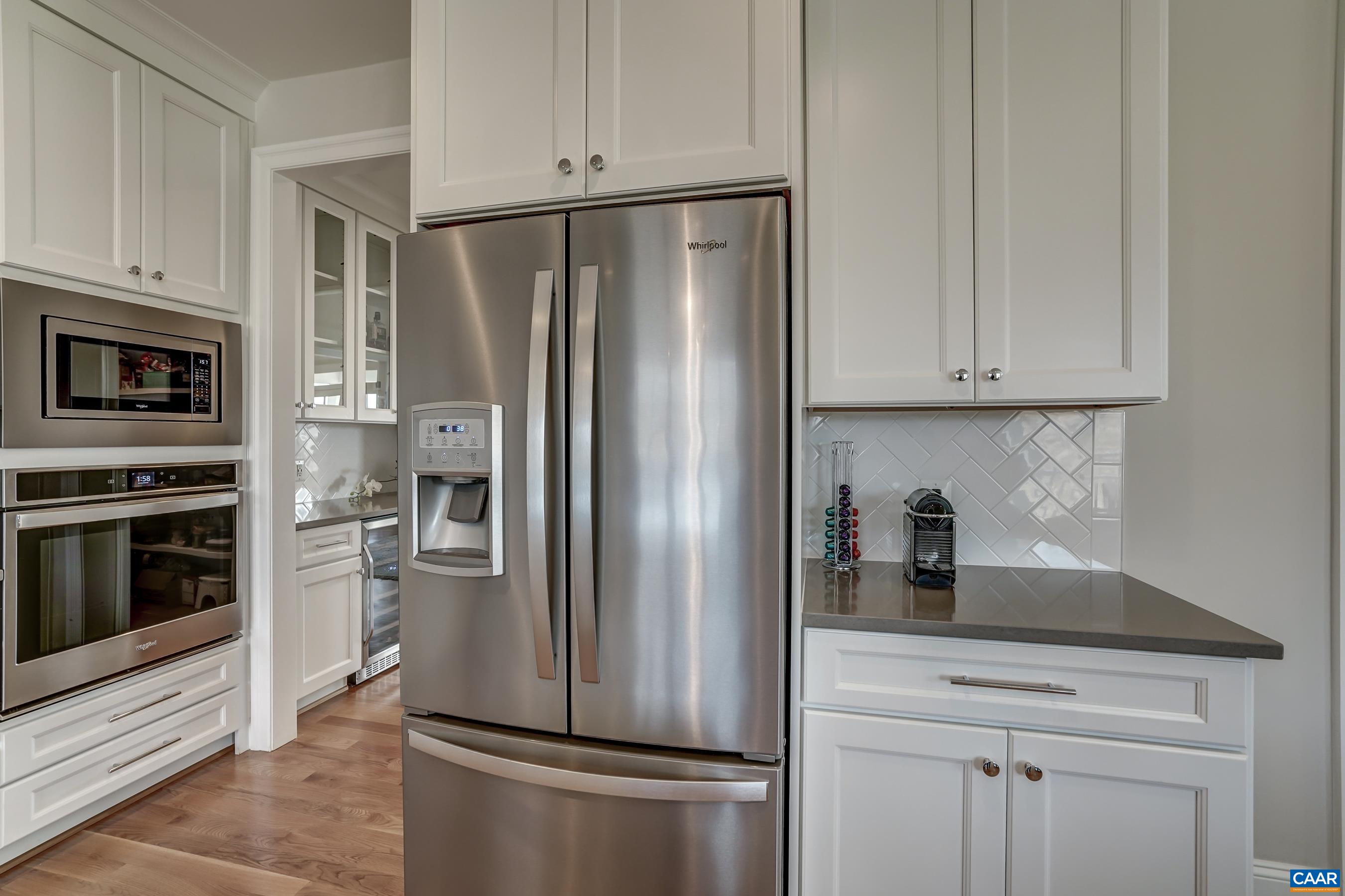 424 Claibourne Road Crozet, VA 22932 - Photo 17 of 64 a kitchen with stainless steel appliances granite countertop a refrigerator a stove a microwave and cabinets