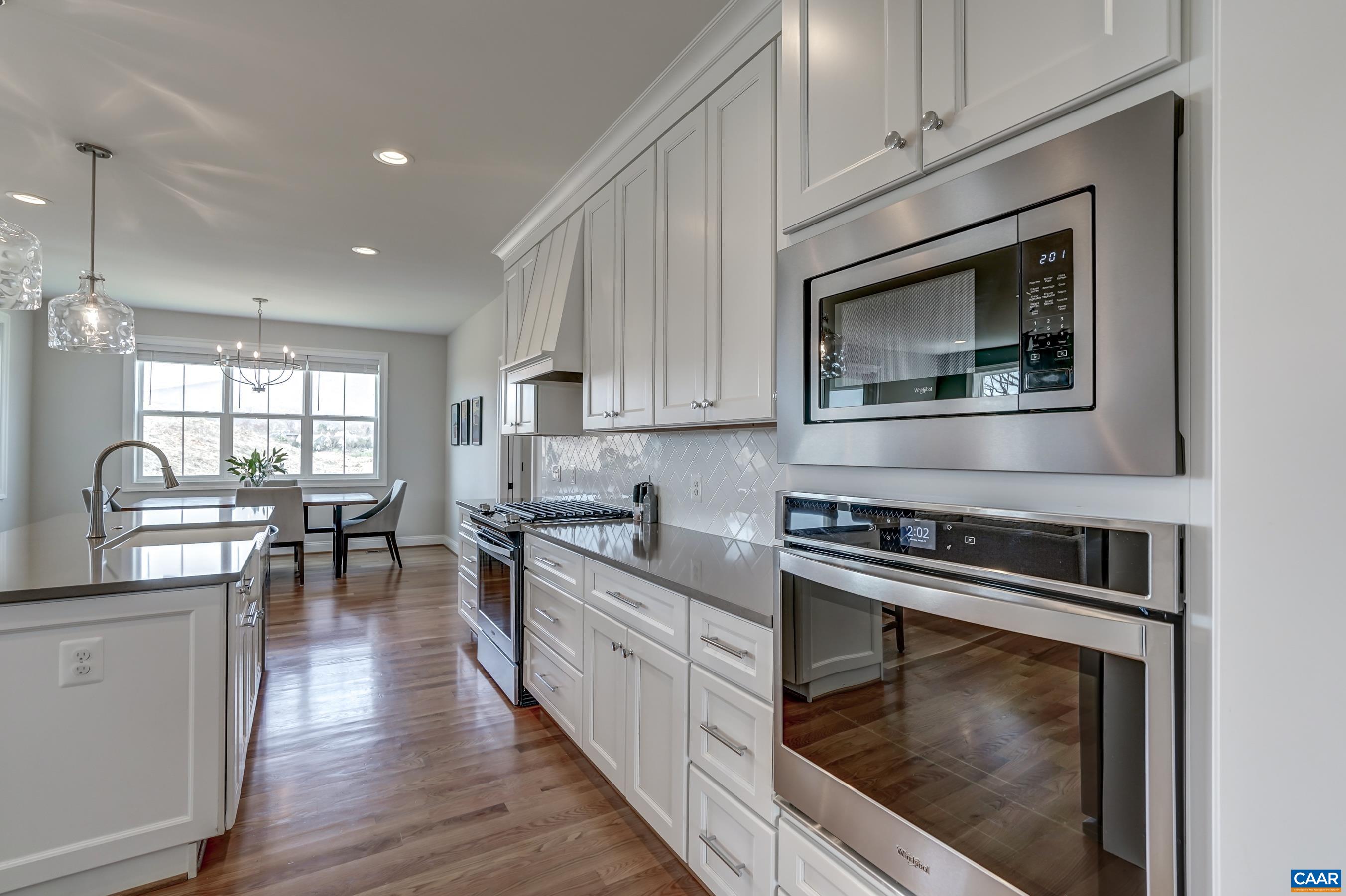 424 Claibourne Road Crozet, VA 22932 - Photo 21 of 64 a kitchen with sink stove and cabinets