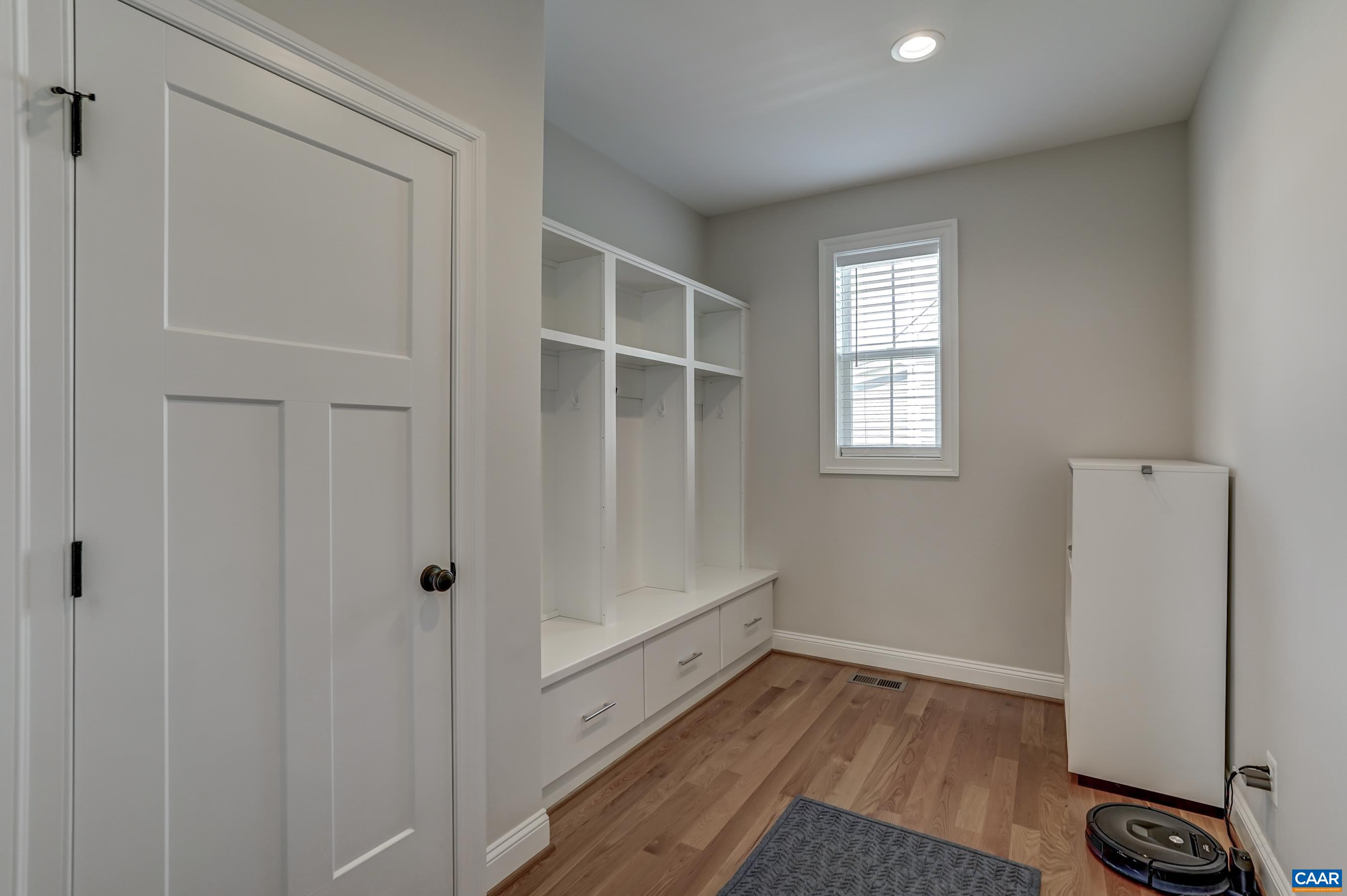 424 Claibourne Road Crozet, VA 22932 - Photo 29 of 64 a view of an empty room with wooden floor and a window