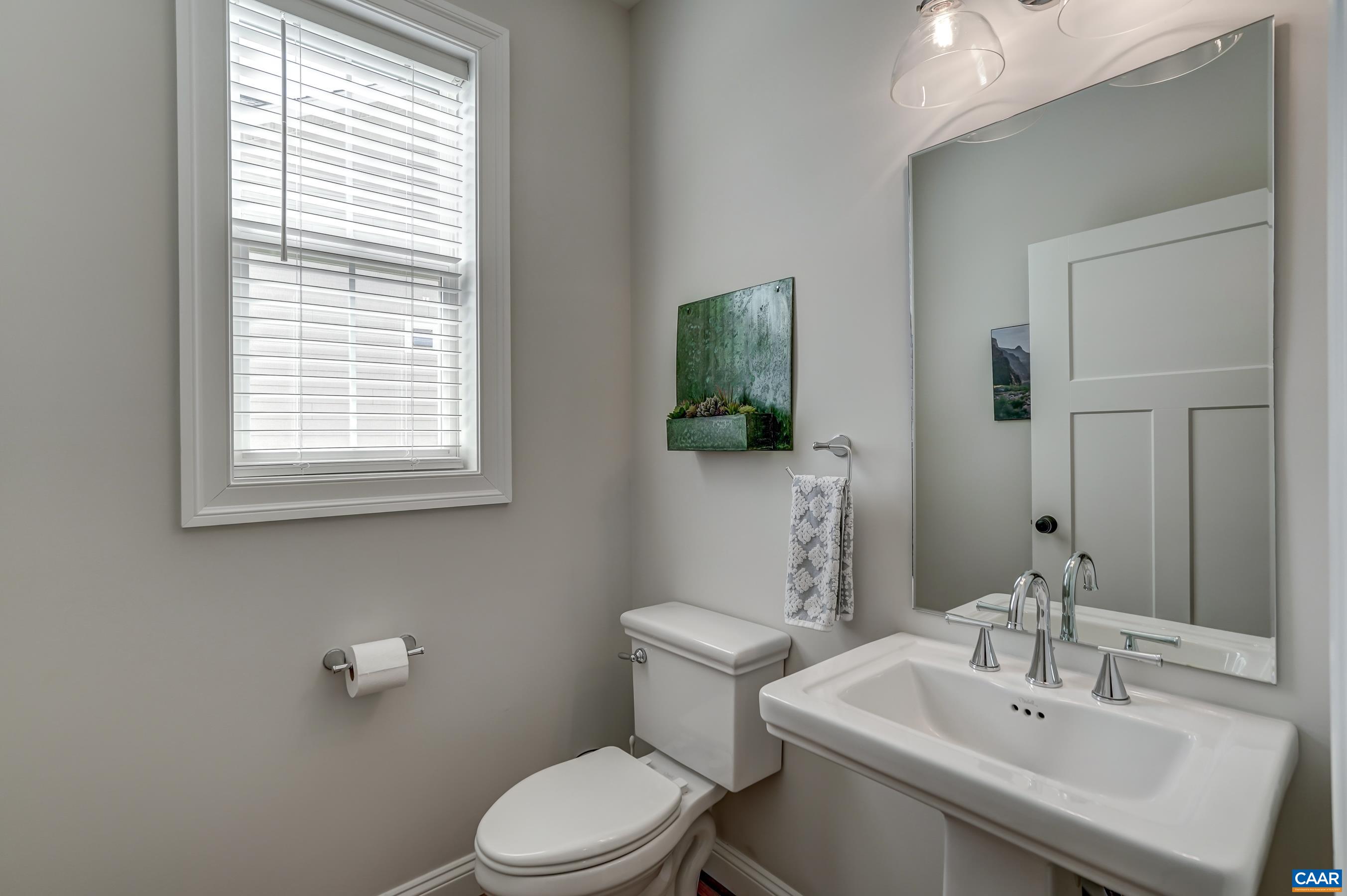 424 Claibourne Road Crozet, VA 22932 - Photo 30 of 64 a bathroom with a sink a toilet and mirror