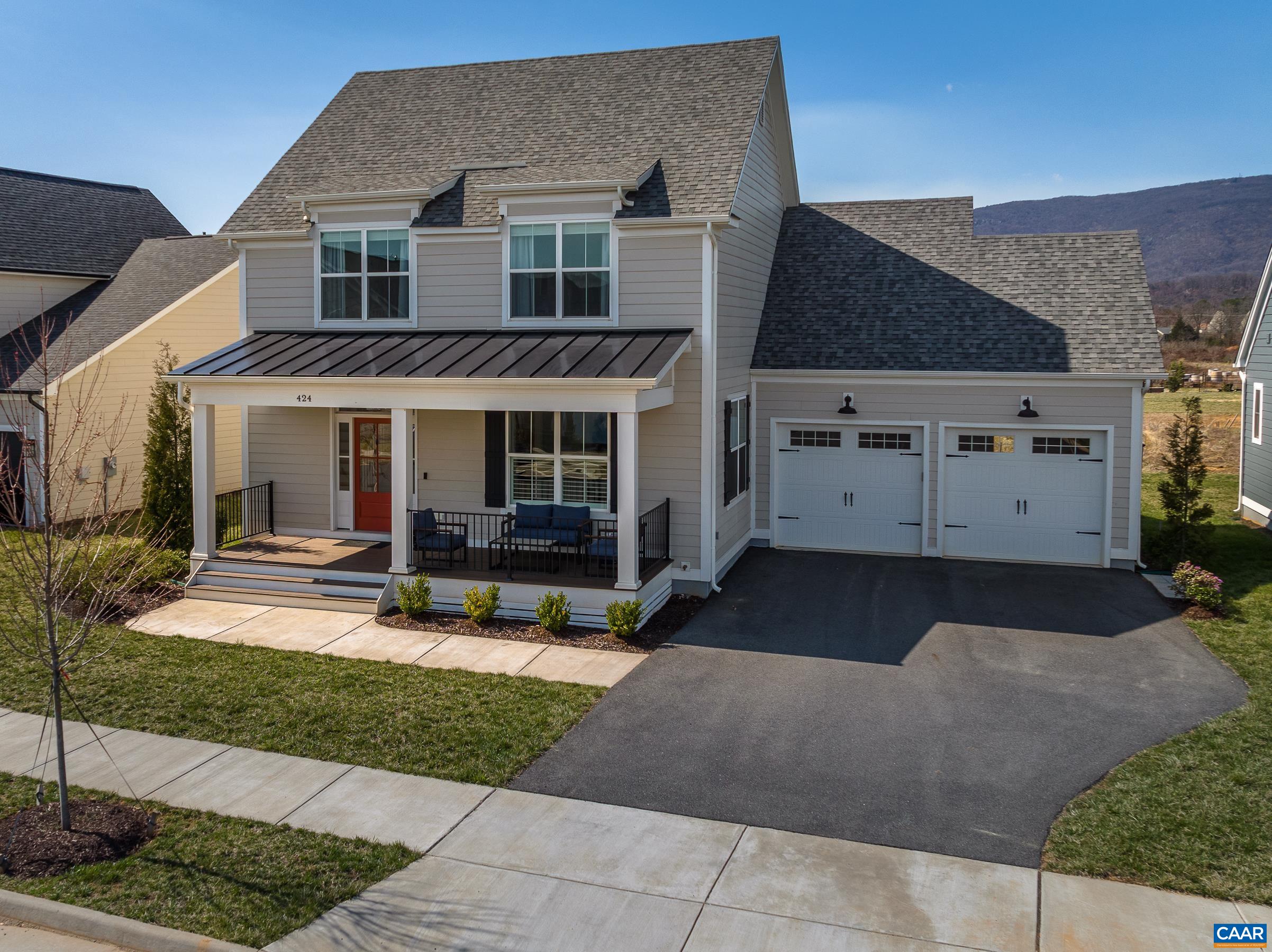 424 Claibourne Road Crozet, VA 22932 - Photo 60 of 64 a front view of a house with a yard and garage