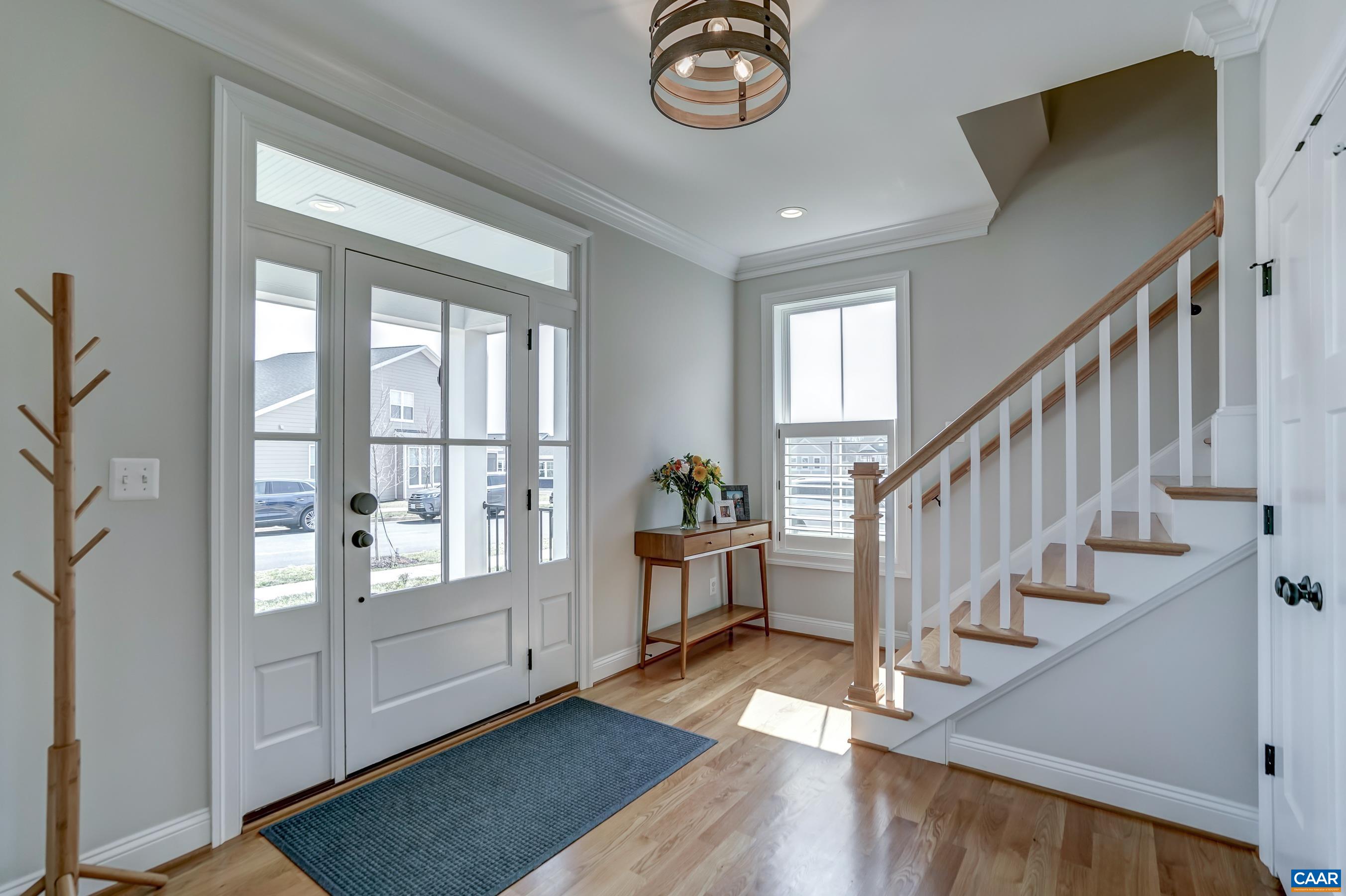 424 Claibourne Road Crozet, VA 22932 - Photo 6 of 64 a view of an entryway with wooden floor and windows