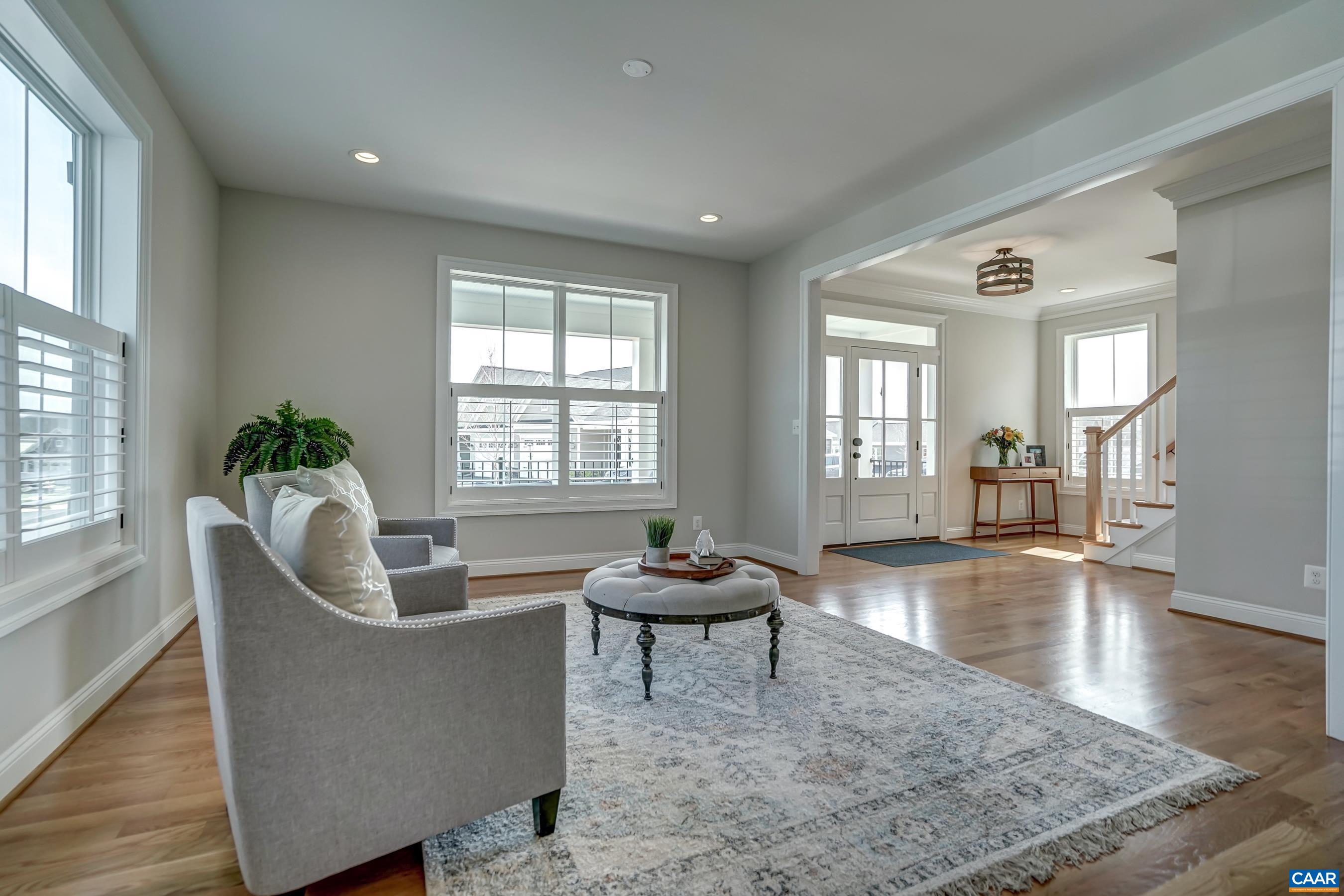 424 Claibourne Road Crozet, VA 22932 - Photo 9 of 64 a living room with furniture and a potted plant
