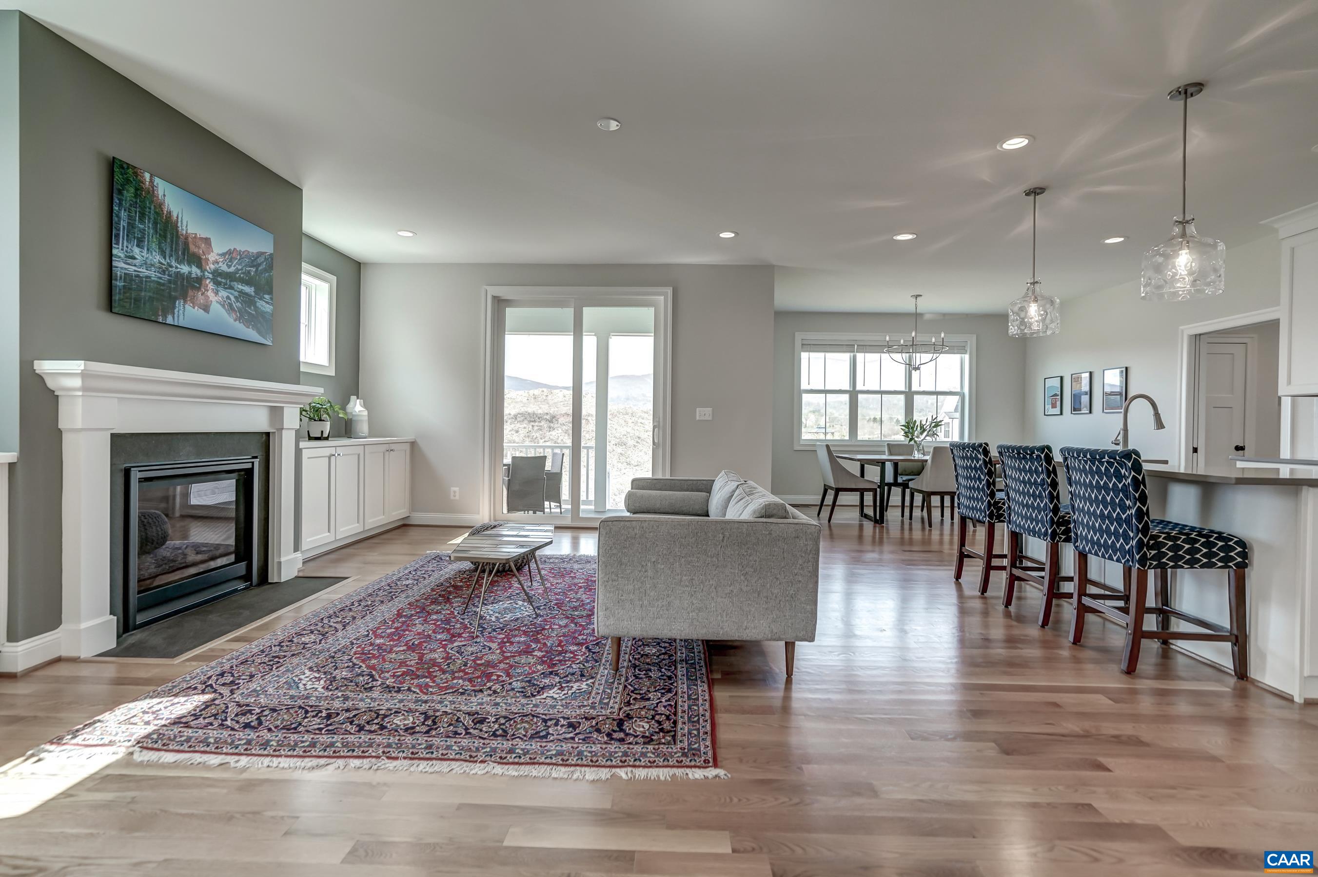 424 Claibourne Road Crozet, VA 22932 - Photo 10 of 64 a living room with furniture a large window and a fireplace