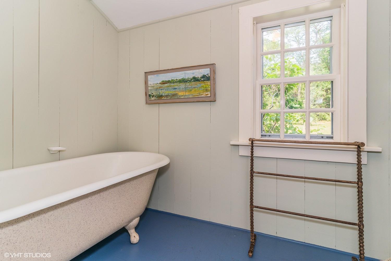 35 Mill Hill Road Wellfleet, MA 02667 - Photo 17 of 25 a bathroom with a bathtub and a window