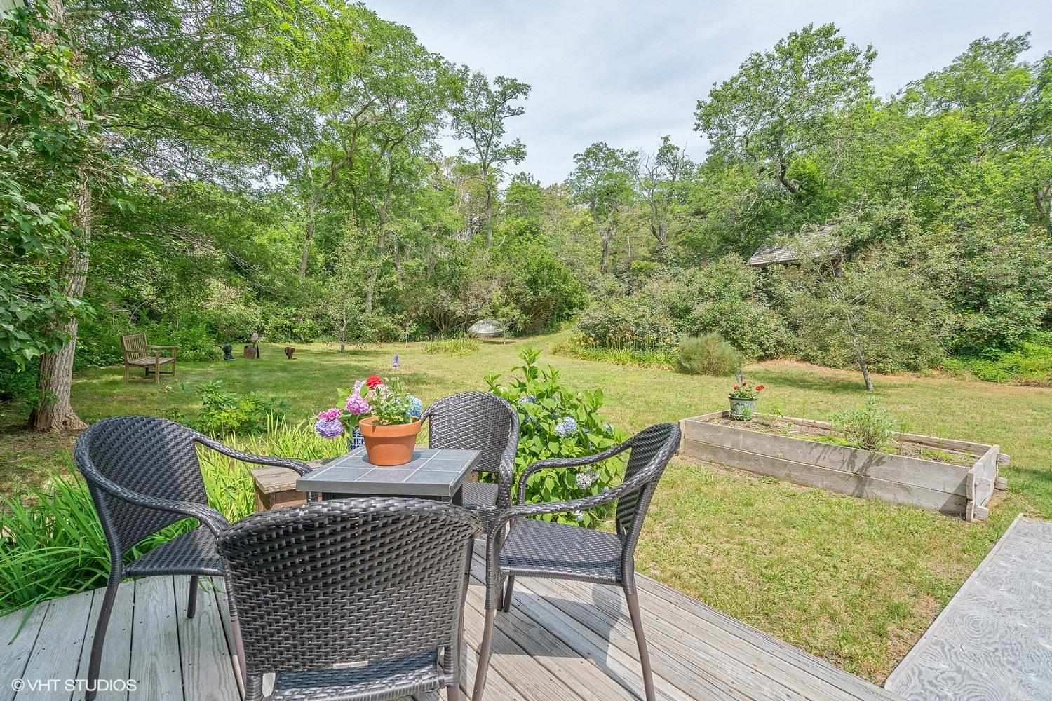 35 Mill Hill Road Wellfleet, MA 02667 - Photo 18 of 25 an outdoor sitting area with furniture and a yard