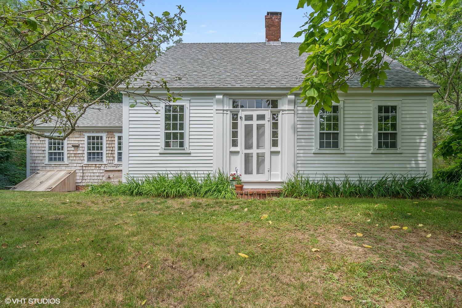 35 Mill Hill Road Wellfleet, MA 02667 - Photo 2 of 25 a front view of a house with a yard