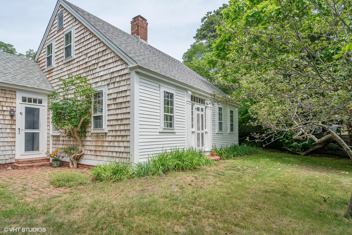 35 Mill Hill Road Wellfleet, MA 02667 - Photo 3 of 25 a view of a house with a yard and plants