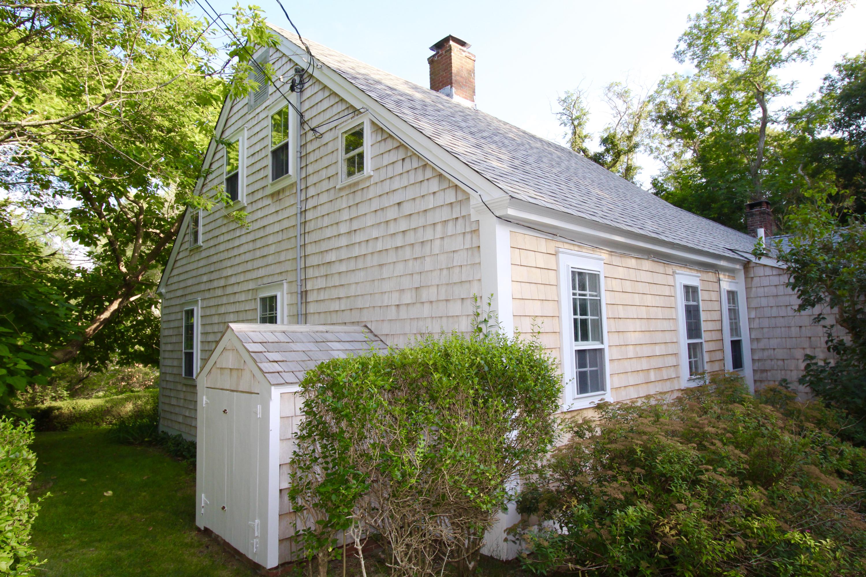35 Mill Hill Road Wellfleet, MA 02667 - Photo 5 of 25 a view of a house with a yard and plants