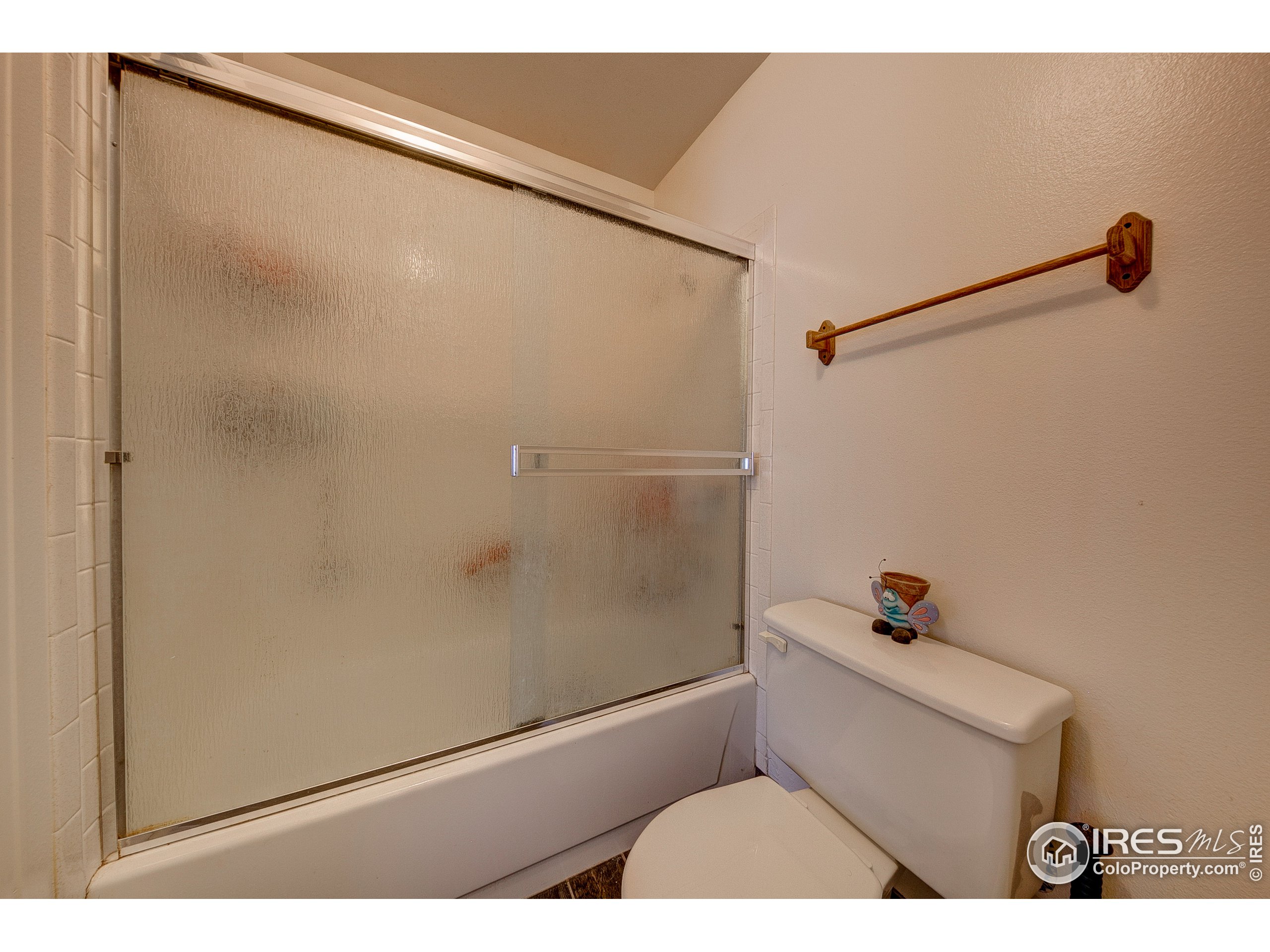 1640 Kirkwood Drive, Unit 2022 Fort Collins, CO 80525 - Photo 18 of 20 a bathroom with a shower and a toilet