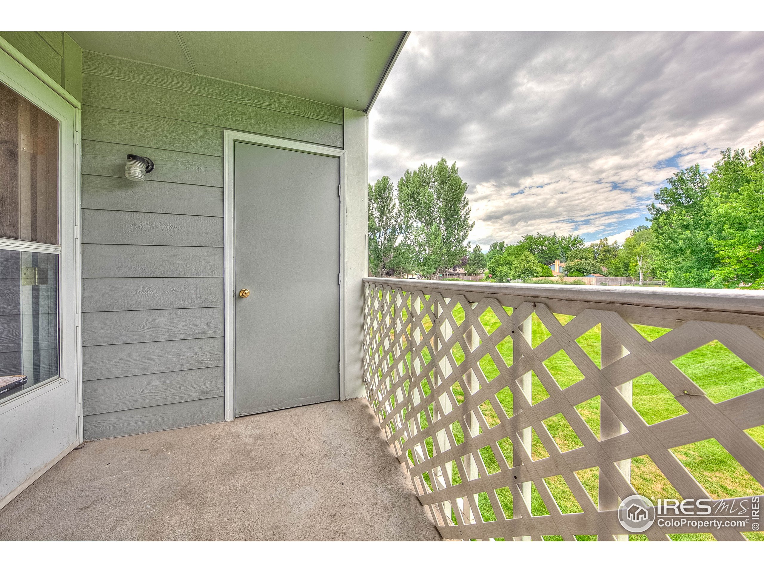 1640 Kirkwood Drive, Unit 2022 Fort Collins, CO 80525 - Photo 20 of 20 a view of outdoor space and porch