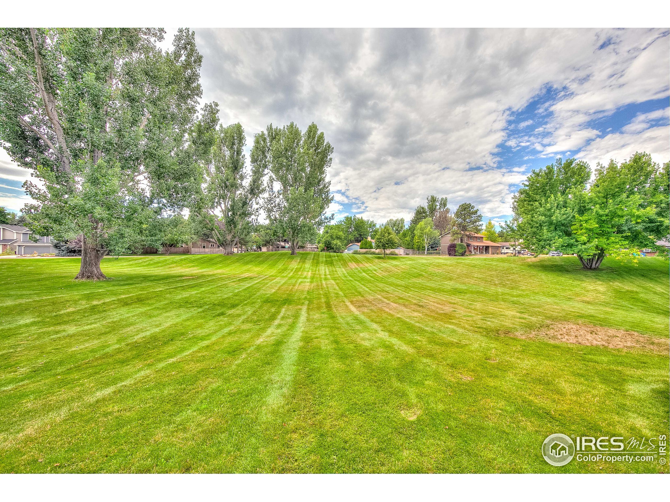1640 Kirkwood Drive, Unit 2022 Fort Collins, CO 80525 - Photo 4 of 20 a view of swimming pool with an outdoor space and seating area
