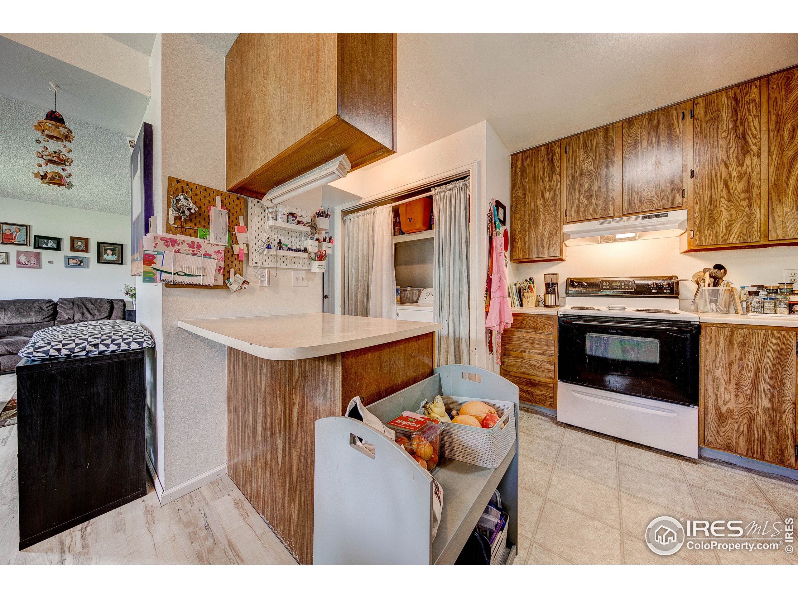 1640 Kirkwood Drive, Unit 2022 Fort Collins, CO 80525 - Photo 8 of 20 a open kitchen with stainless steel appliances granite countertop a stove and a refrigerator
