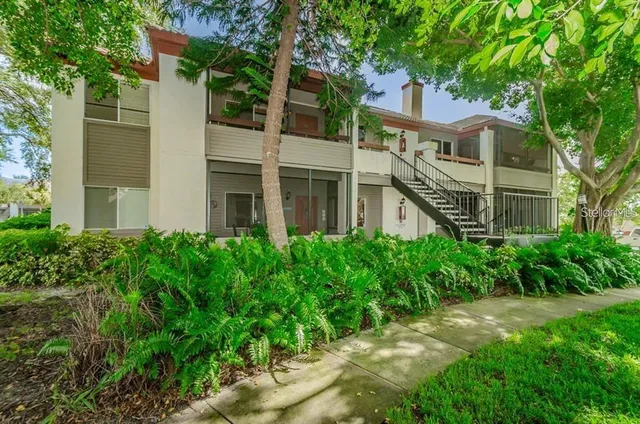 a kitchen with a stove a refrigerator and a sink