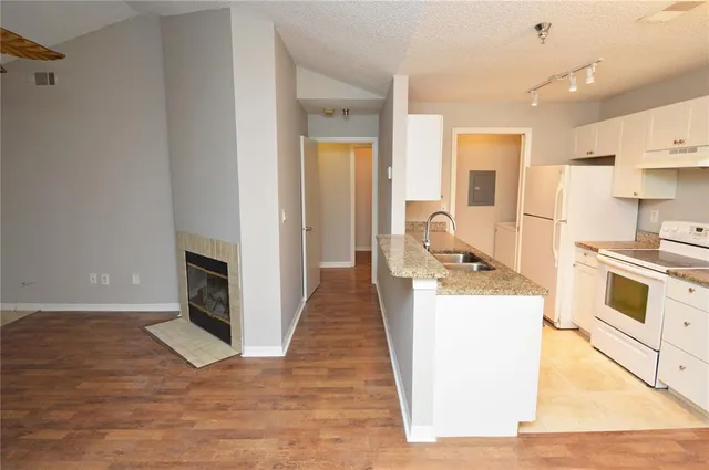 a view of an empty room with a fan