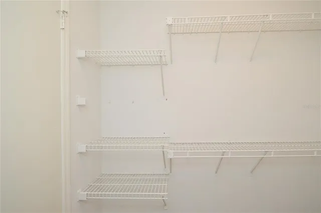 a white toilet sitting next to a bath tub