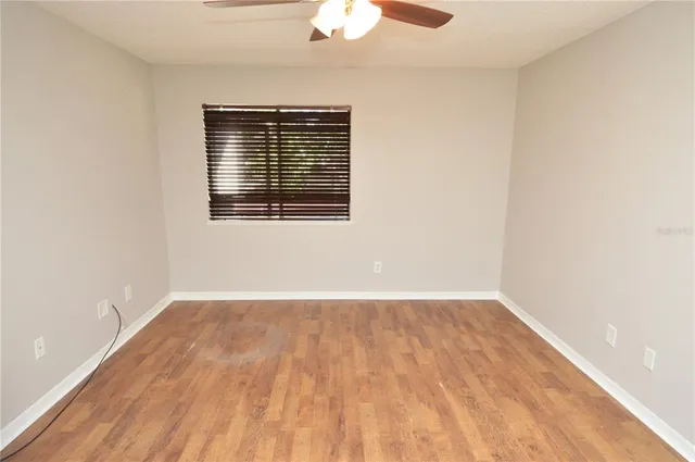 an aerial view of residential houses with outdoor space and river