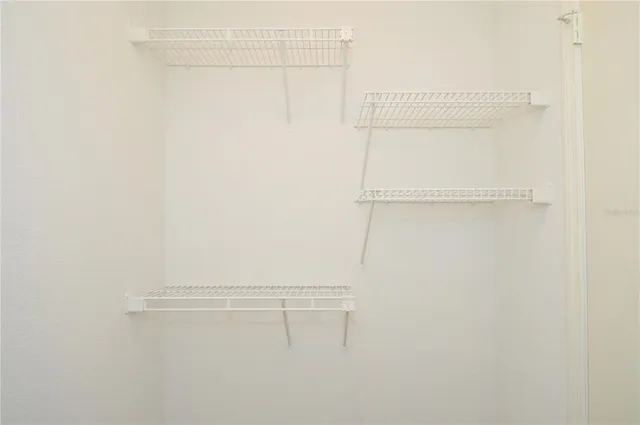 a view of a chairs and table in patio