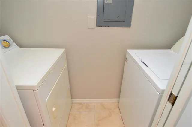 a view of empty room with wooden floor and fireplace
