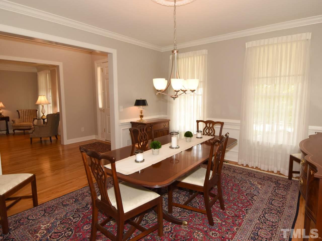 11833 Lowery Ridge Drive Raleigh, NC 27614 - Photo 11 of 25 Spacious Dining room has wainscoting and fresh paint.