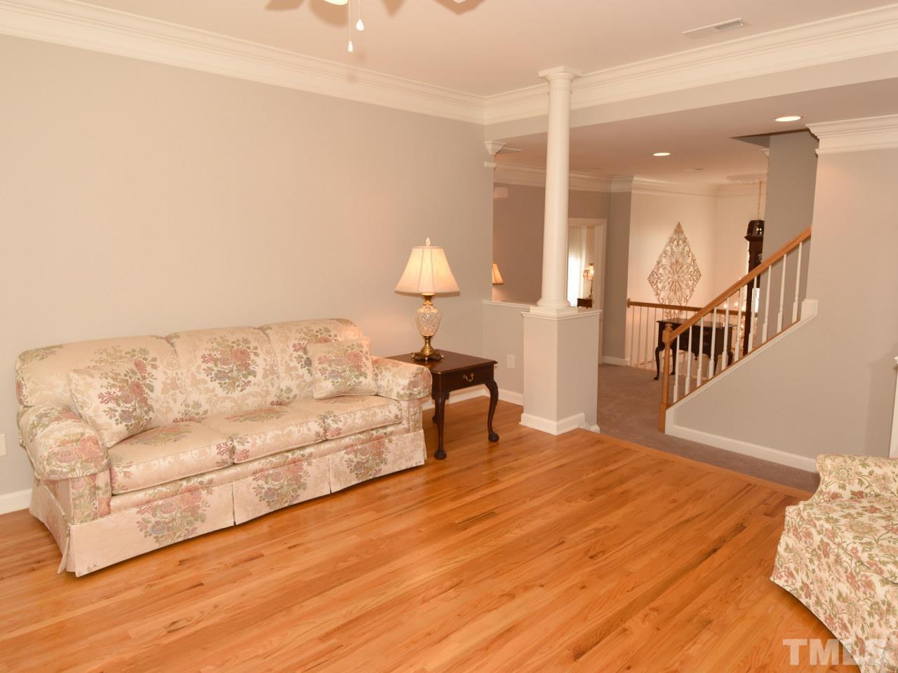 11833 Lowery Ridge Drive Raleigh, NC 27614 - Photo 16 of 25 Spacious Bonus room on the 2nd floor has been upgraded to fully hardwood floors. Perfect for a TV room or playroom. Stairs in the background of photo lead to the walk up attic (3rd floor).