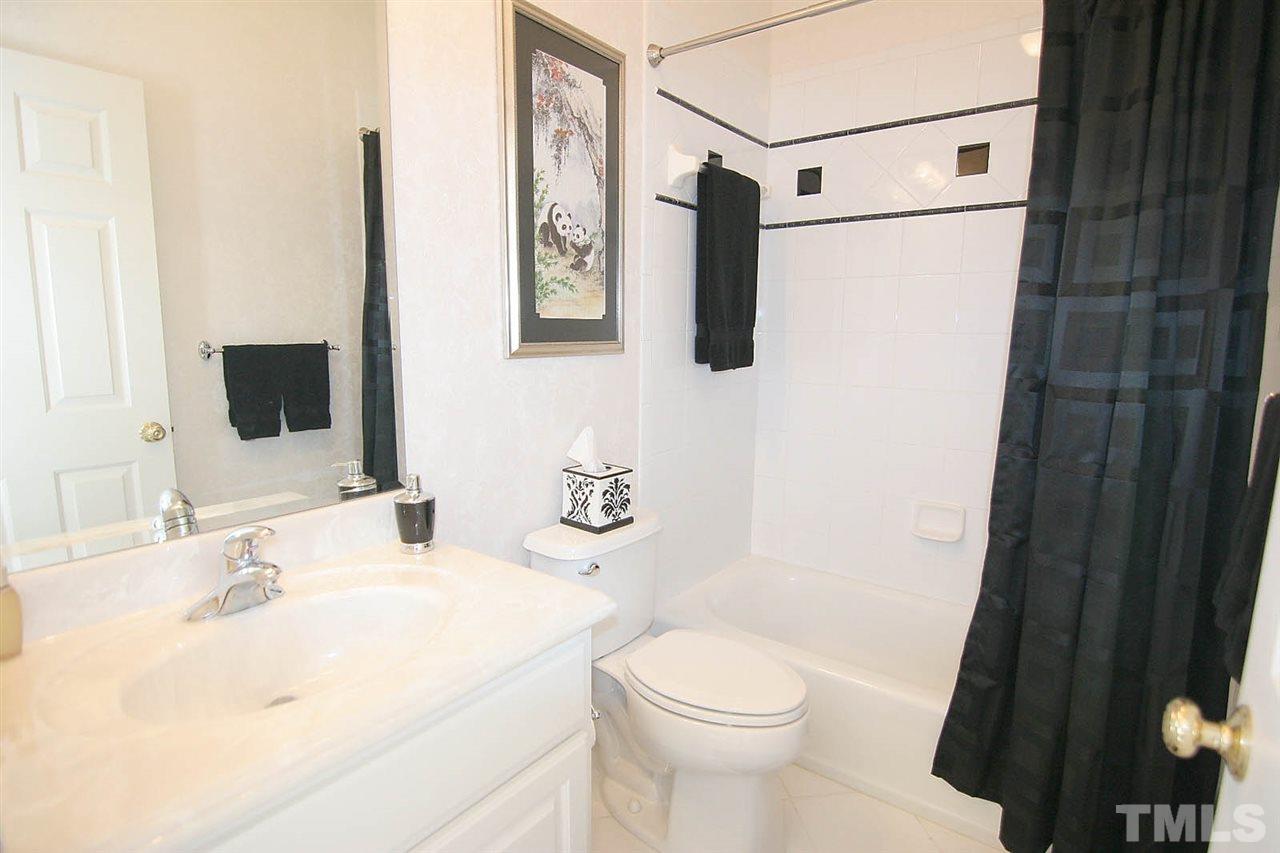 11833 Lowery Ridge Drive Raleigh, NC 27614 - Photo 18 of 25 Custom Shower Tile work in all four bathrooms as well as upgraded marble vanities in all baths. This bathroom is attached to a guest room which can be used as a "2nd master" and perfect for guests.
