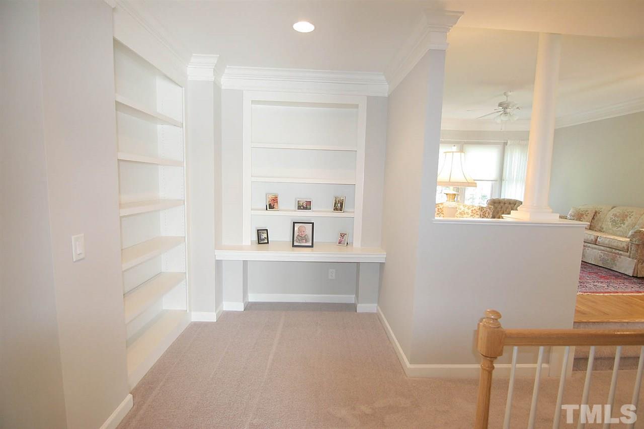 11833 Lowery Ridge Drive Raleigh, NC 27614 - Photo 21 of 25 Built in bookshelves in family room as well as near bonus room. This area also includes a built in desk.
