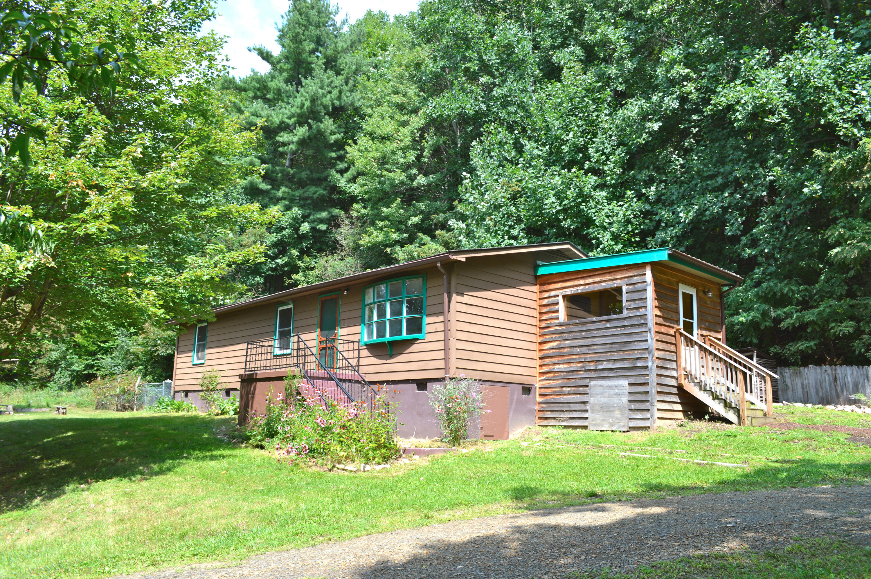 5075 Alum Ridge Road Northwest Riner, VA 24149 - Photo 1 of 28 a front view of house with yard and green space