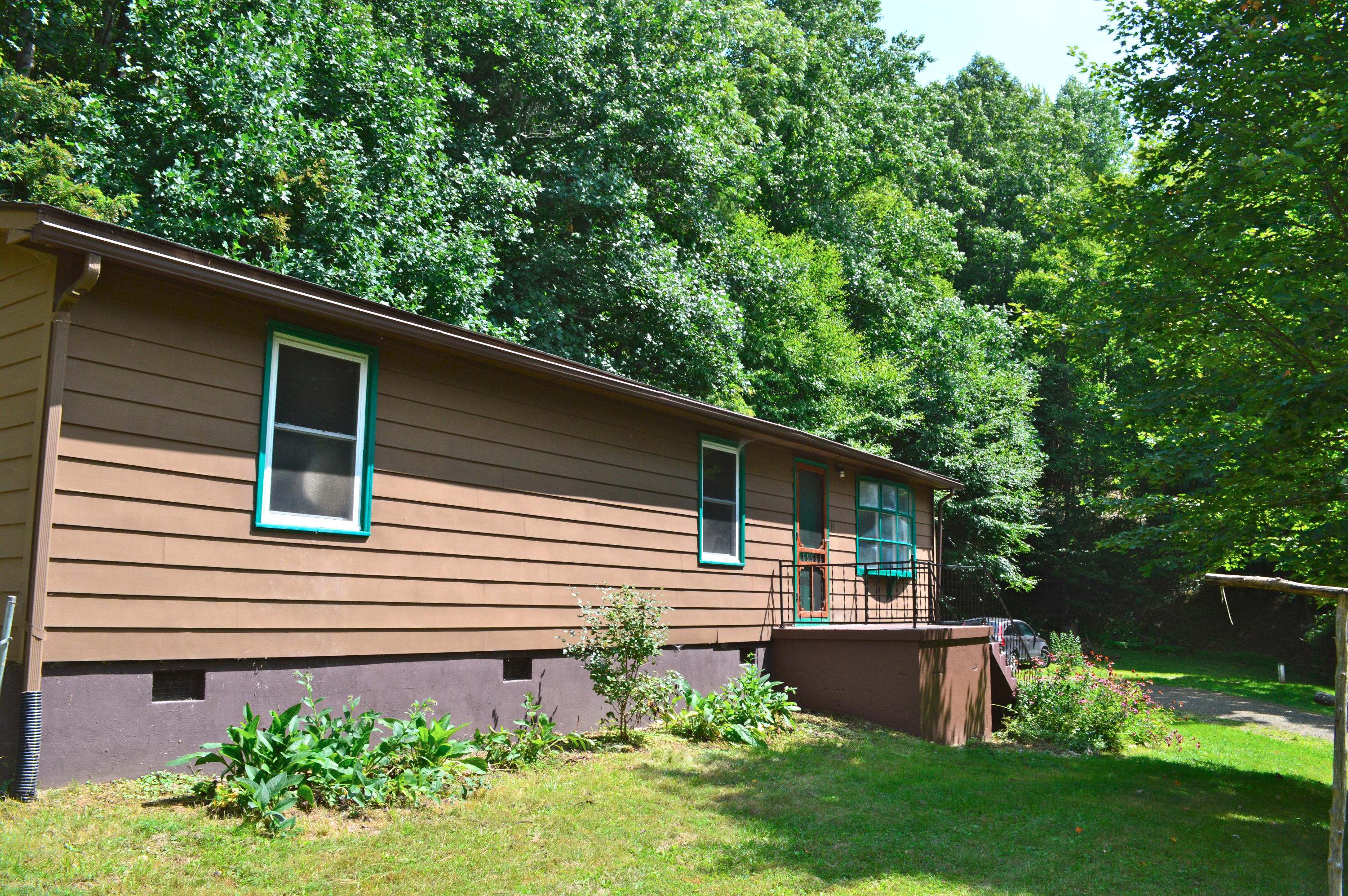 5075 Alum Ridge Road Northwest Riner, VA 24149 - Photo 20 of 28 a front view of a house with garden