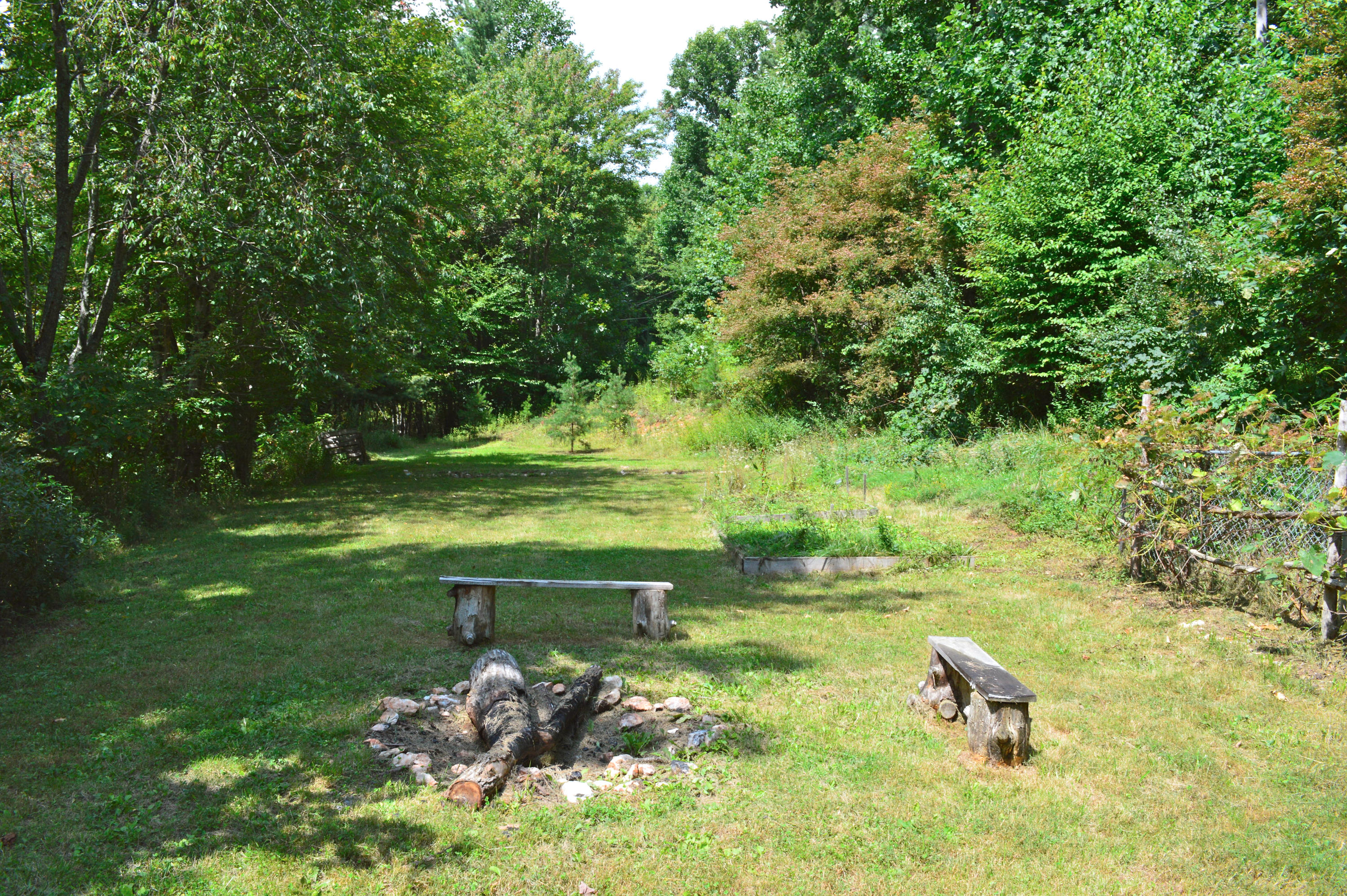 5075 Alum Ridge Road Northwest Riner, VA 24149 - Photo 21 of 28 a view of a lake with a yard