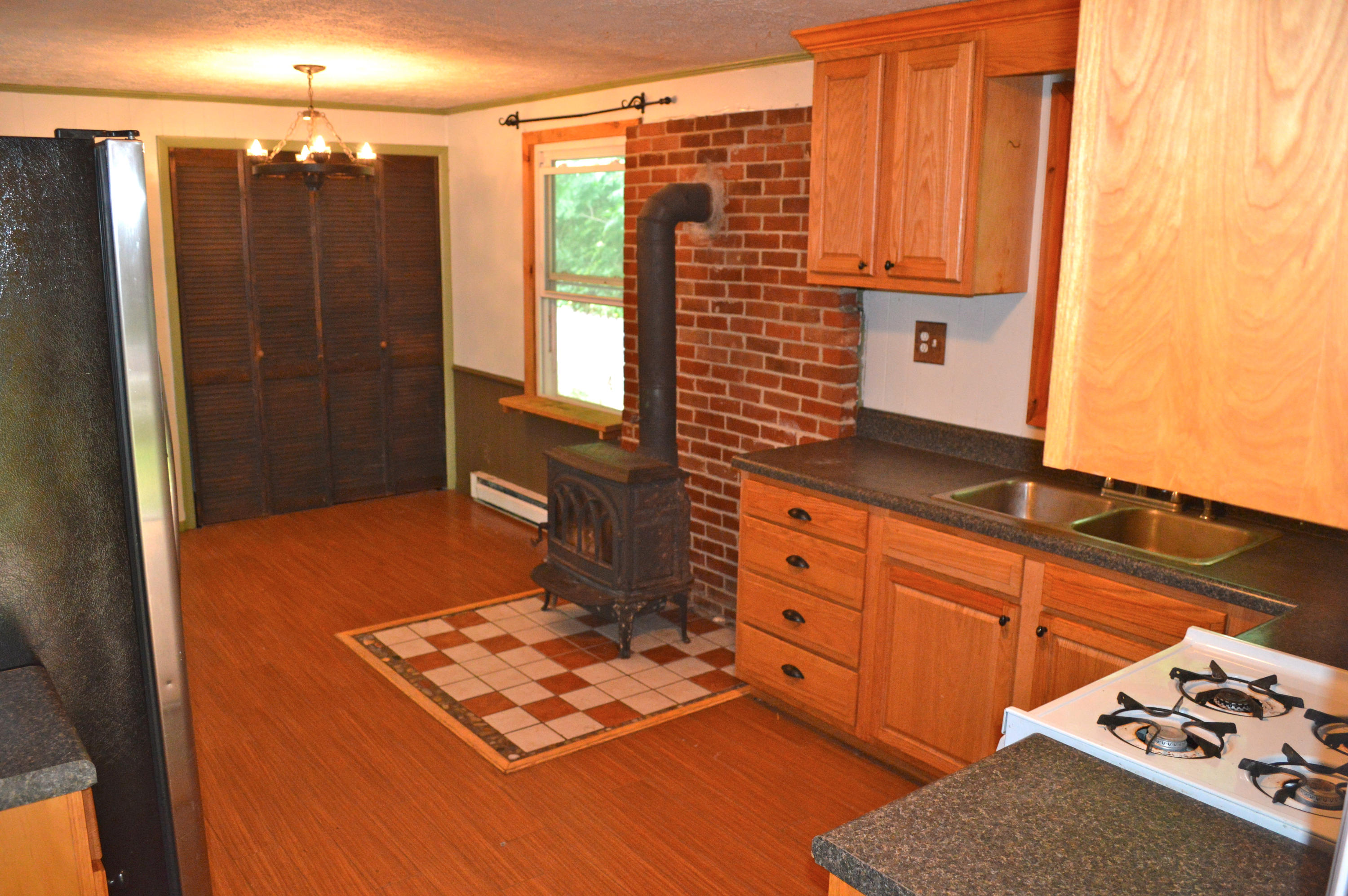 5075 Alum Ridge Road Northwest Riner, VA 24149 - Photo 5 of 28 a living room with stainless steel appliances furniture a rug and a window
