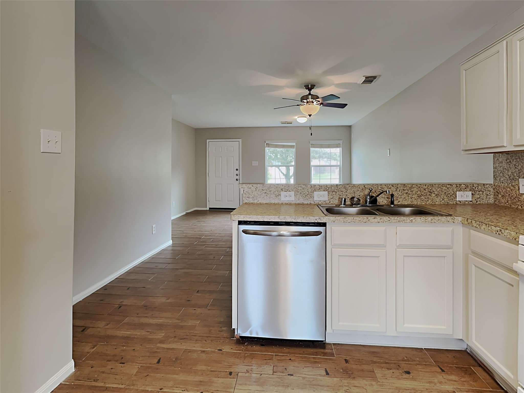 8119 Katie Mill Trail Spring, TX 77379 - Photo 13 of 18 a kitchen with granite countertop white cabinets and white appliances