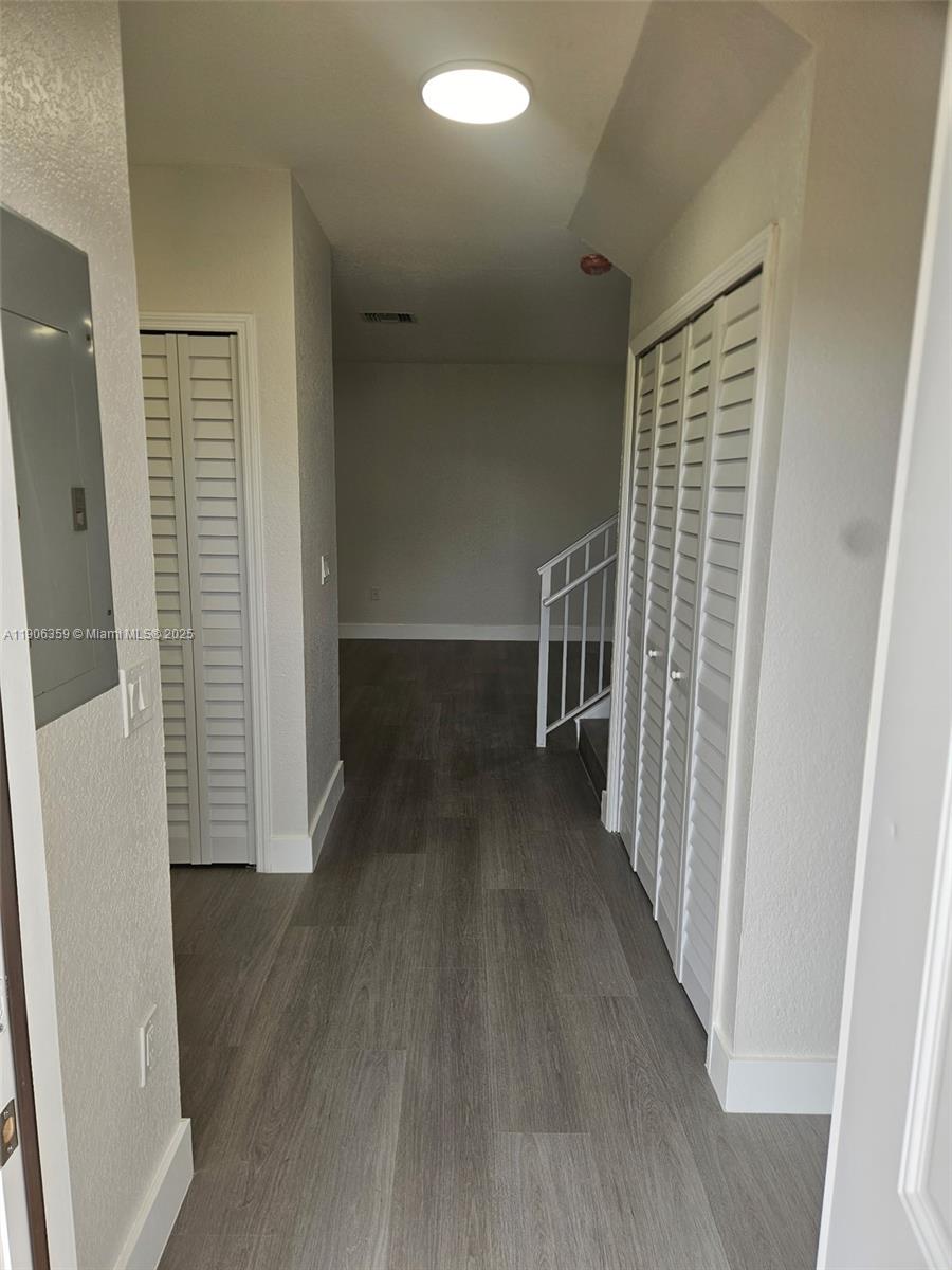 6752 Northwest 182nd Street, Unit 101 Hialeah, FL 33015 - Photo 11 of 23 wooden floor in a gallery