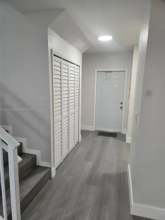 wooden floor in an empty room and a window