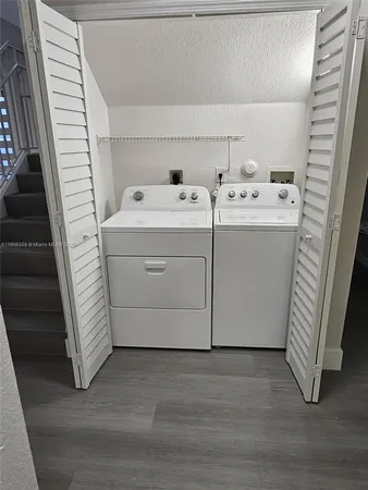 a view of staircase with white walls