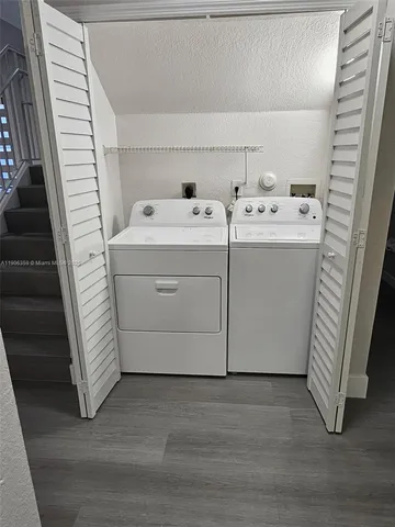 a view of staircase with white walls