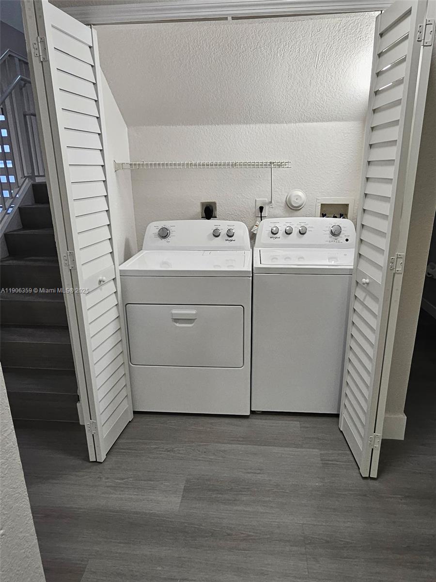 6752 Northwest 182nd Street, Unit 101 Hialeah, FL 33015 - Photo 14 of 23 a utility room with dryer and washer